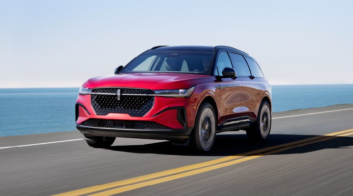 A 2024 Lincoln Nautilus® SUV is being driven on a seaside roadway. | J.C. Lewis Lincoln in Savannah GA