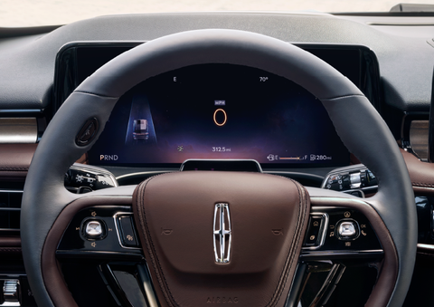 The steering wheel of 2025 Lincoln Aviator® SUV is shown with black and brown accents. | J.C. Lewis Lincoln in Savannah GA