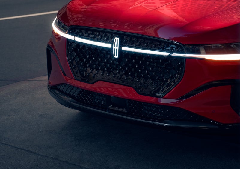 The available front LED light bar and center Lincoln Star logo glow at dusk. | J.C. Lewis Lincoln in Savannah GA