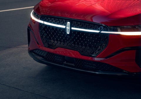 The available front LED light bar and center Lincoln Star logo glow at dusk. | J.C. Lewis Lincoln in Savannah GA