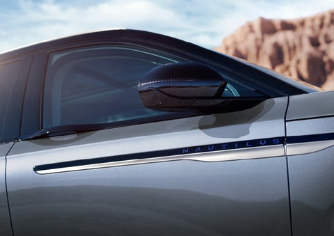 Blue lettering on the side of the vehicle that reads nautilus indicates the available hybrid powertrain. | J.C. Lewis Lincoln in Savannah GA