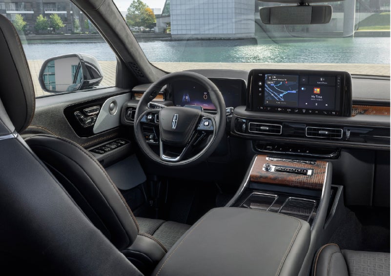 The interior of the 2026 Lincoln Aviator® SUV is shown parked with a view of a harbor through the windshield. | J.C. Lewis Lincoln in Savannah GA