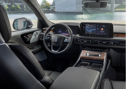 The interior of the 2026 Lincoln Aviator® SUV is shown parked with a view of a harbor through the windshield. | J.C. Lewis Lincoln in Savannah GA