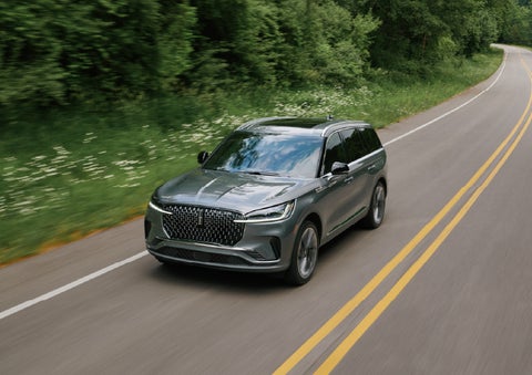A 2027 Lincoln Aviator® SUV is being driven down a road. | J.C. Lewis Lincoln in Savannah GA