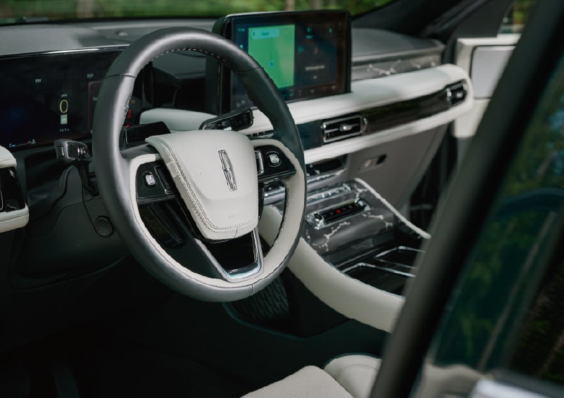 The leather-trimmed steering wheel of a 2027 Lincoln Aviator® Black Label™ SUV. | J.C. Lewis Lincoln in Savannah GA