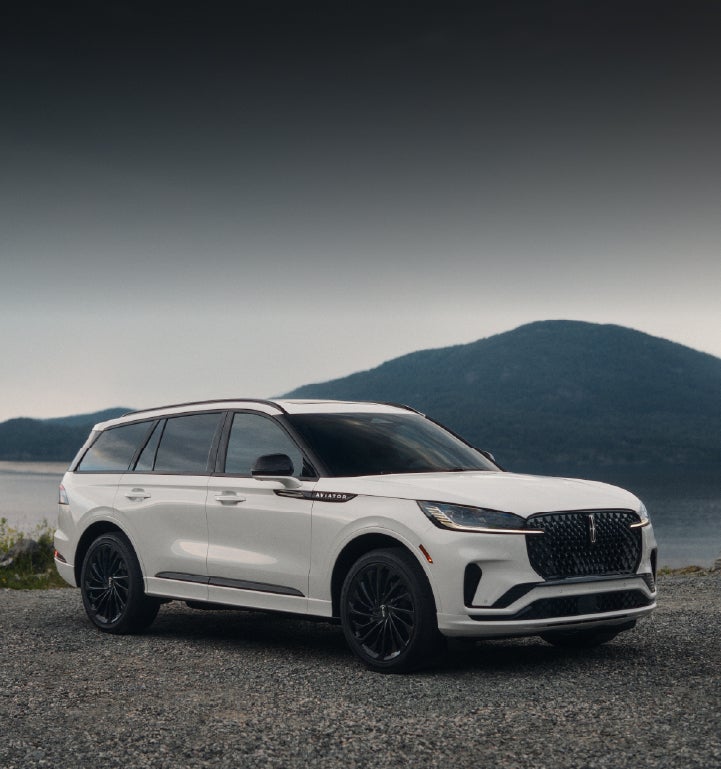 A 2025 Lincoln Aviator® SUV is parked on a mountain overlook.